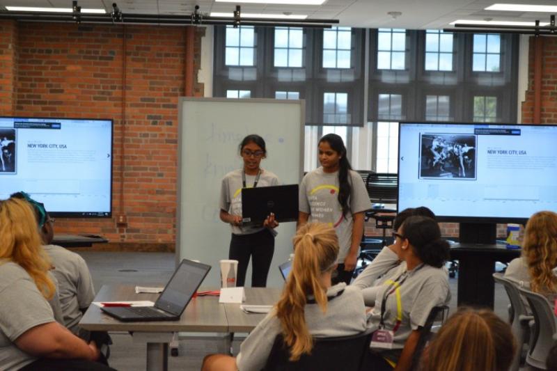 Women in Data Science Photo of summer camp attendees presenting their work