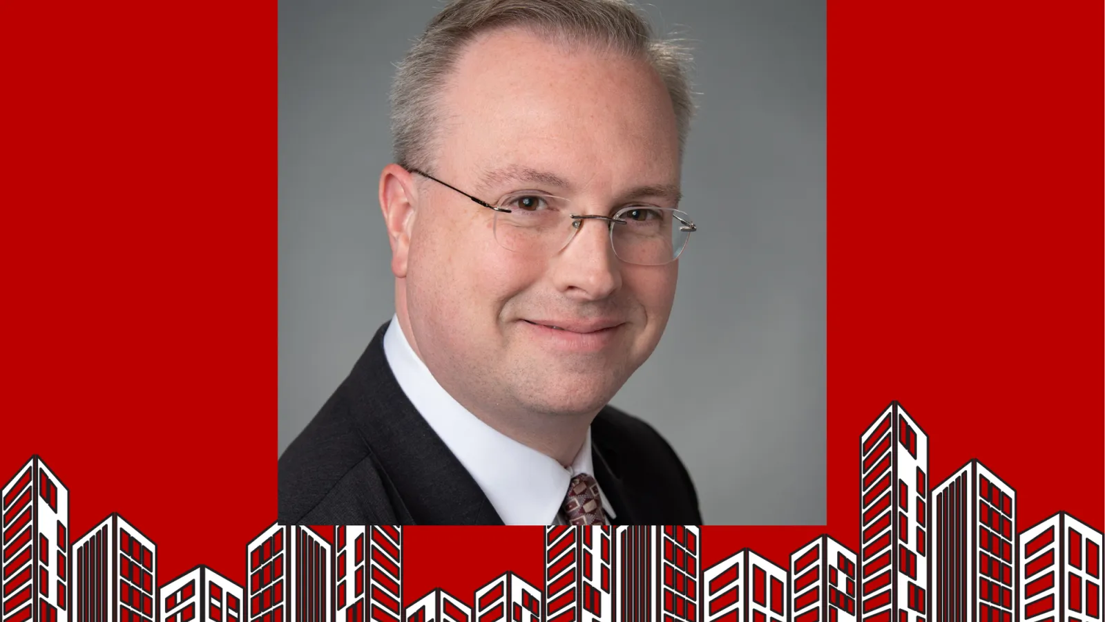 Robert Dietz with building clip art surrounding the photo. 