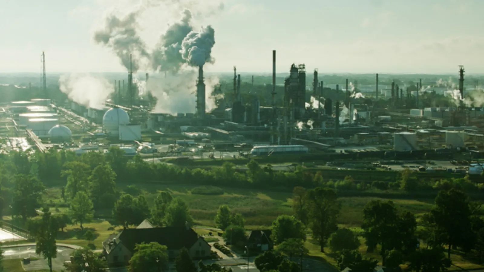 A neighborhood in east Toledo, Ohio, with an oil refinery in the background.