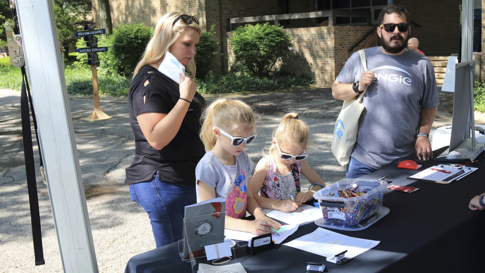 A family enjoying the hands-on mapping activity designed by CURA