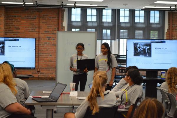 Photo of summer camp attendees presenting their work
