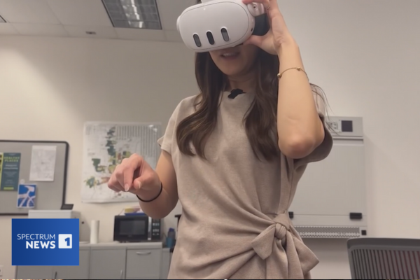 Summer Ha demonstrating the Poindexter Village VR